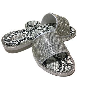 Women’s Snake skin slippers.